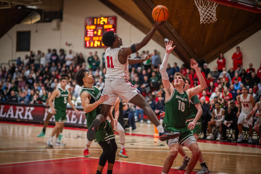 A player going up for a shot during a mens basketball finals game