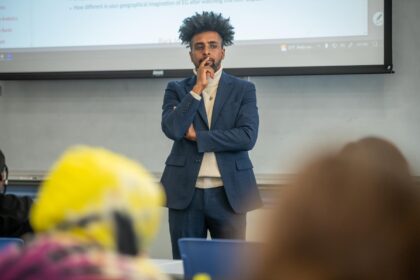 professor standing at front of classroom