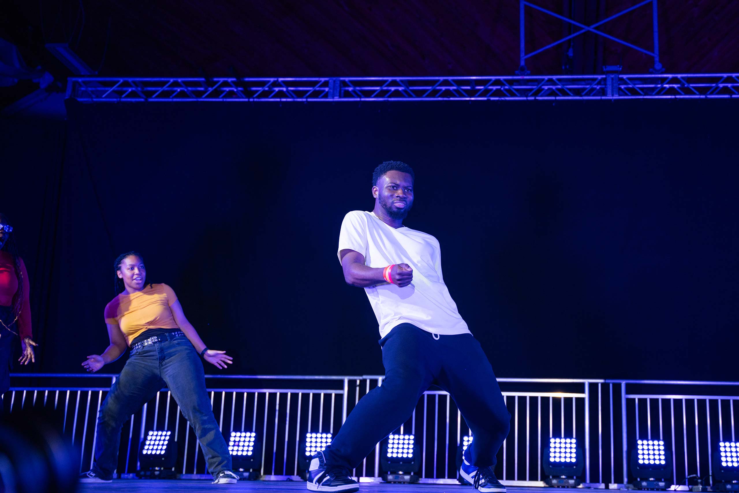 Students dancing with their centers of gravity at a diagonal at the 2024 Gala event