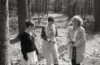 women standing in woods