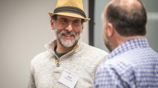 man wearing hat talking