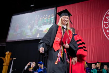 student in cap and gown