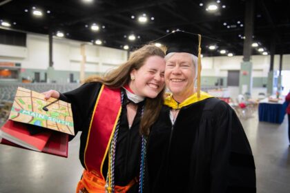 mother and daughter pose at commencement