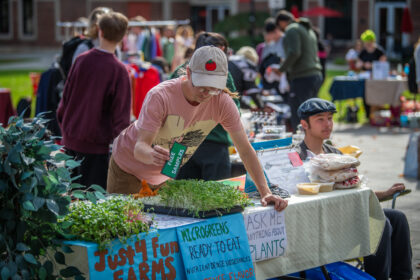 student at table at market