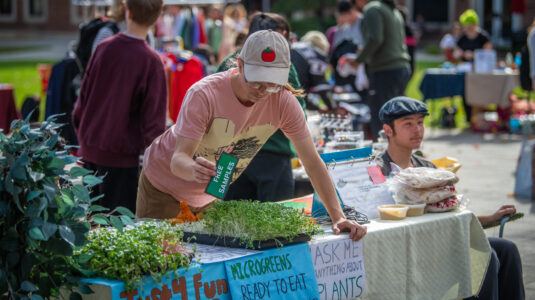 student at table at market