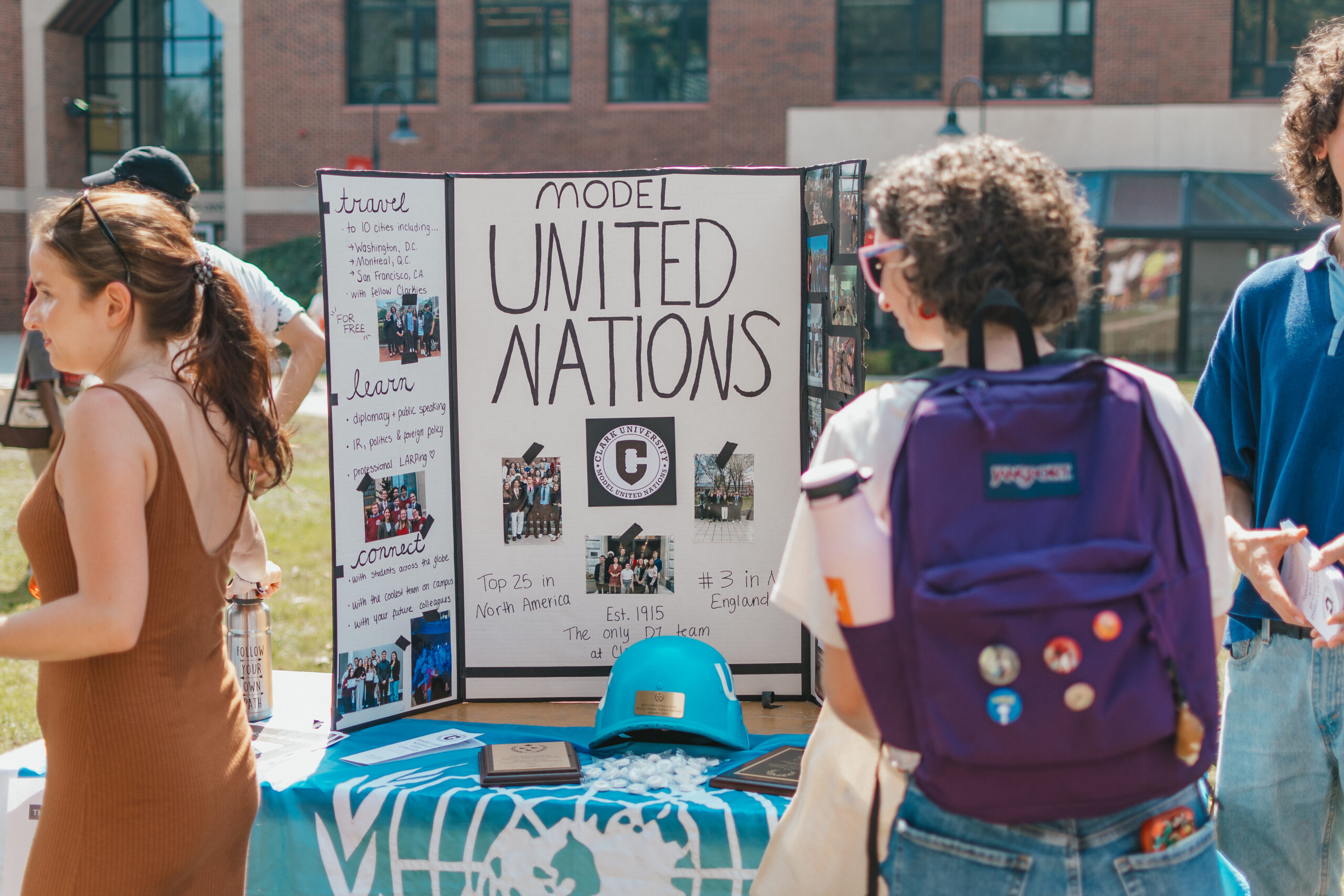 student looks at Model UN poster