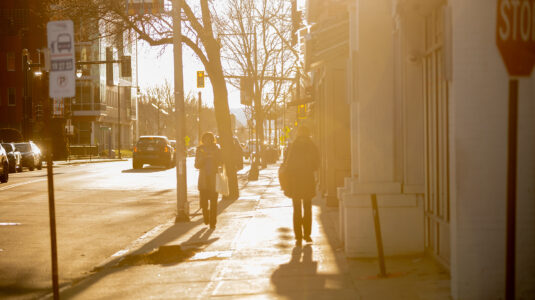 Students walking on Main Street by the Clark University campus