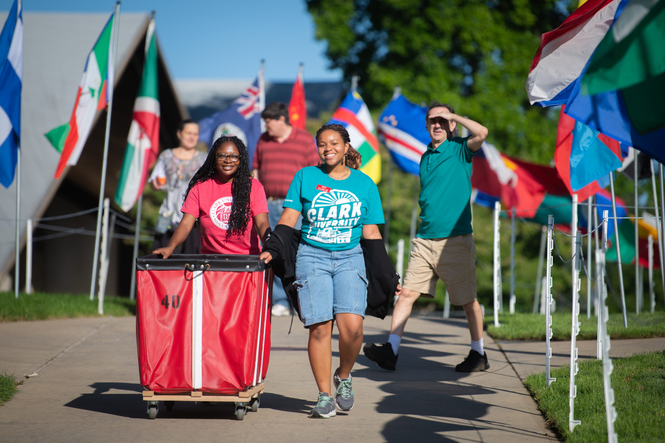 students with bins on move-in day