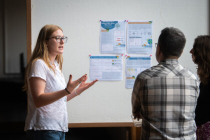 students show research at poster session