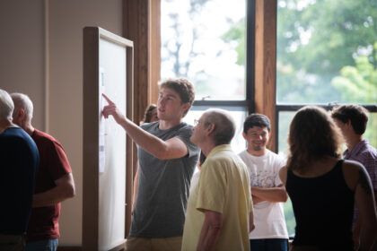 students show research at poster session