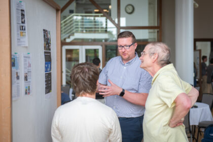 professor talks at poster session