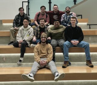 group of students sitting on steps