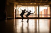 dancers in front of window