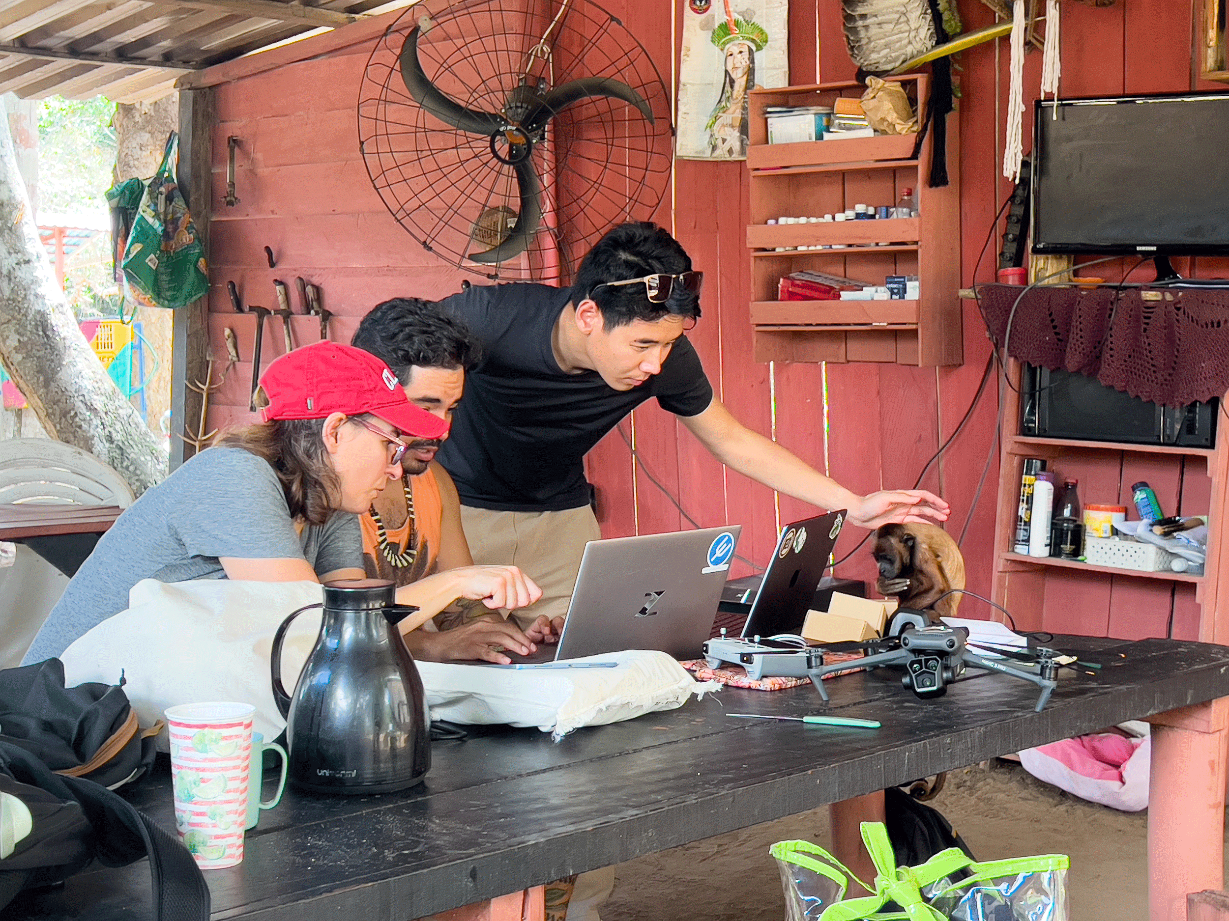 Scientists working at table with monkey