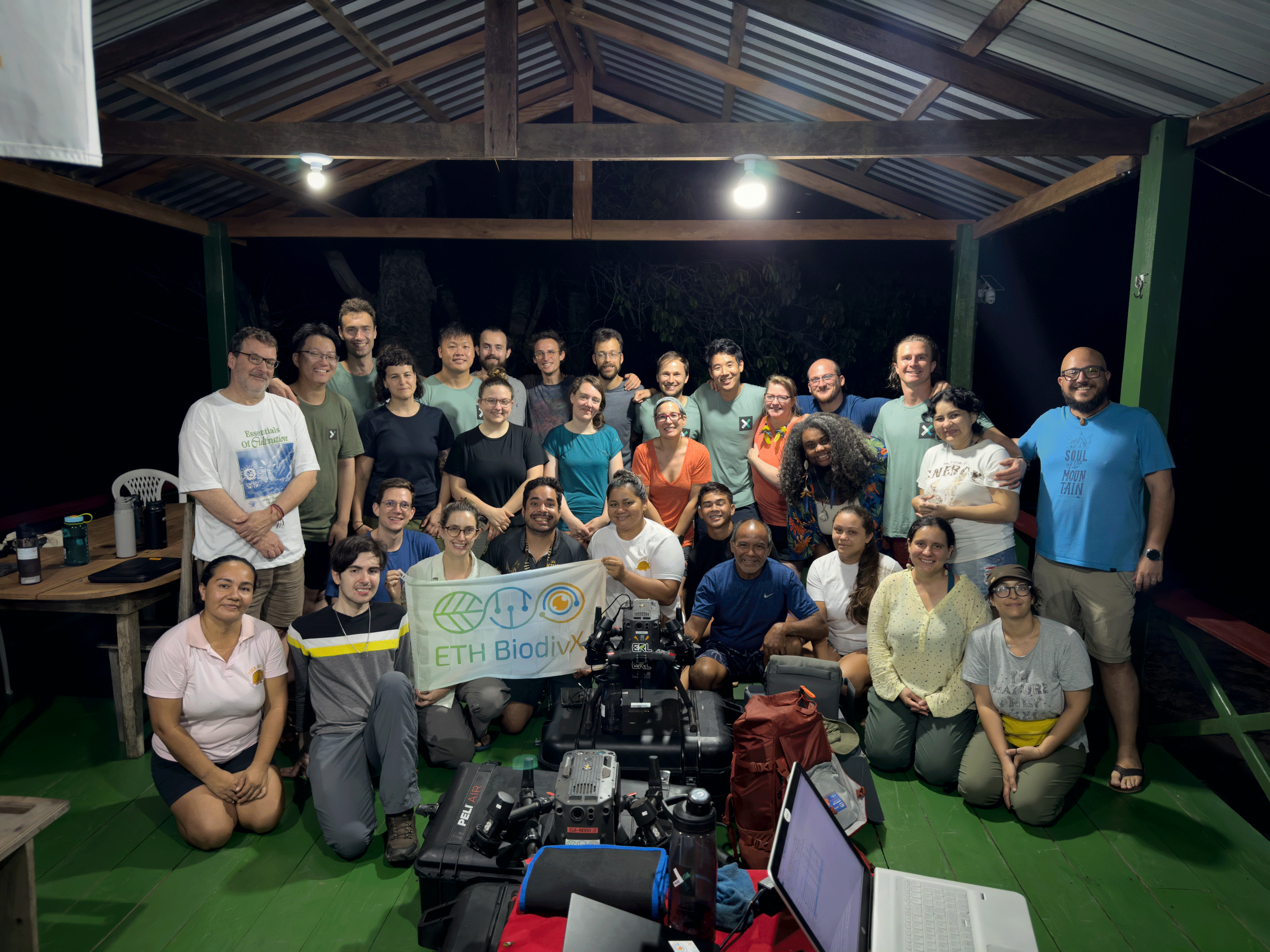 Team members posing with flag