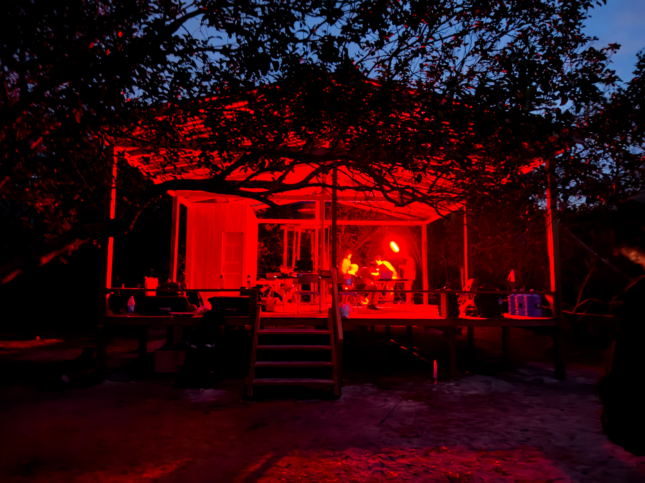 Scientists working in basecamp at night