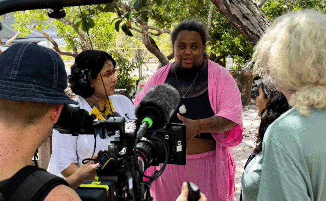 Community members speaking to videographers during filming