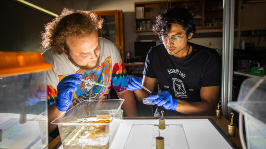 Simon Bissett ’26 and Ph.D. candidate Sohum Kapadia conduct experiments in Professor Arshad Kudrolli’s physics lab.