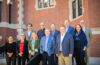 The visiting ESRI team joins Clark Center for Geospatial Analytics Director Hamed Alemohammad, President David Fithian and Provost John Magee on the steps of the Jefferson Academic Center.