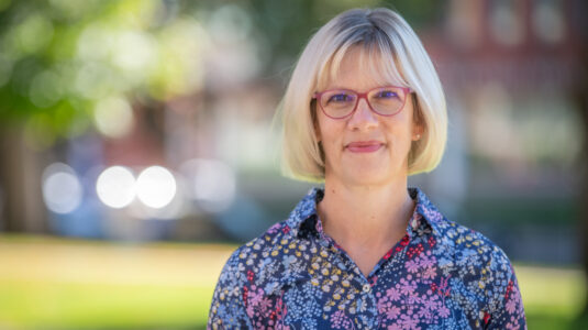 headshot of professor outside