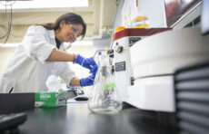 PhD student Maryam Riyazi using equipment in the new lab