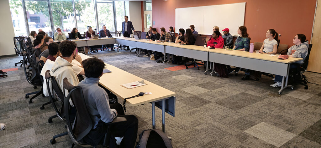 Hamed Alemohammad addresses the attendees at the career panel.