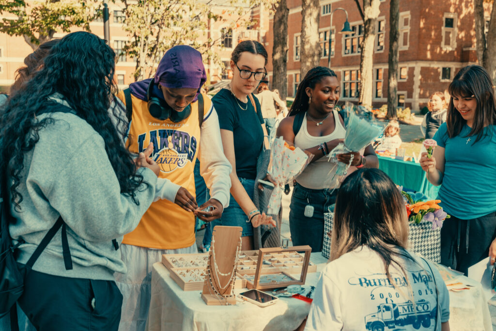 students shop at outdoor market