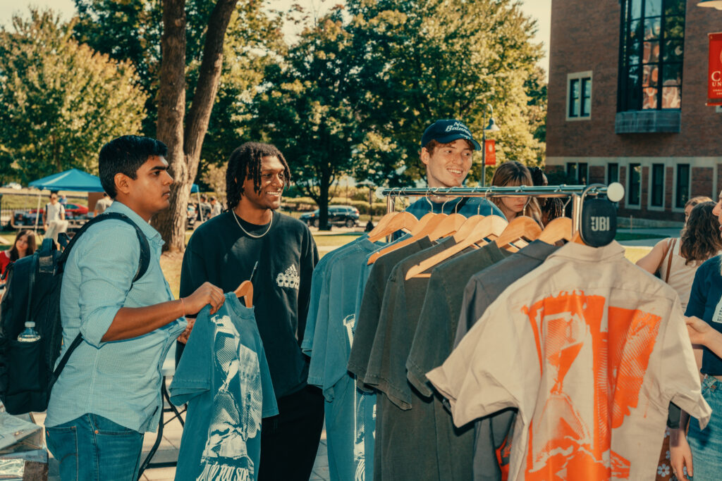 students shop at outdoor market