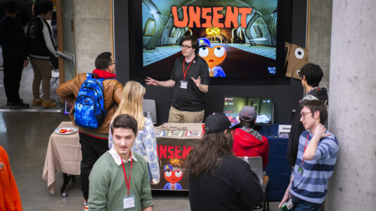 people look at video games during expo