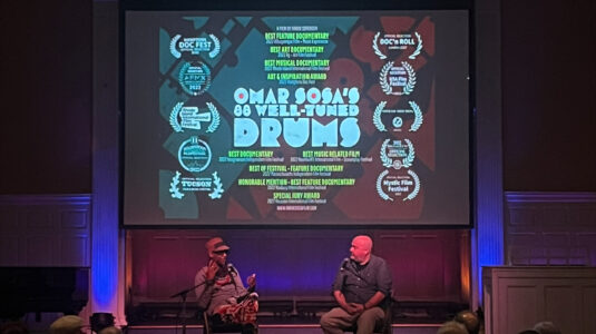 film screening with two people on stage