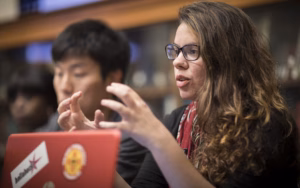 An international development student involved in a classroom discussion