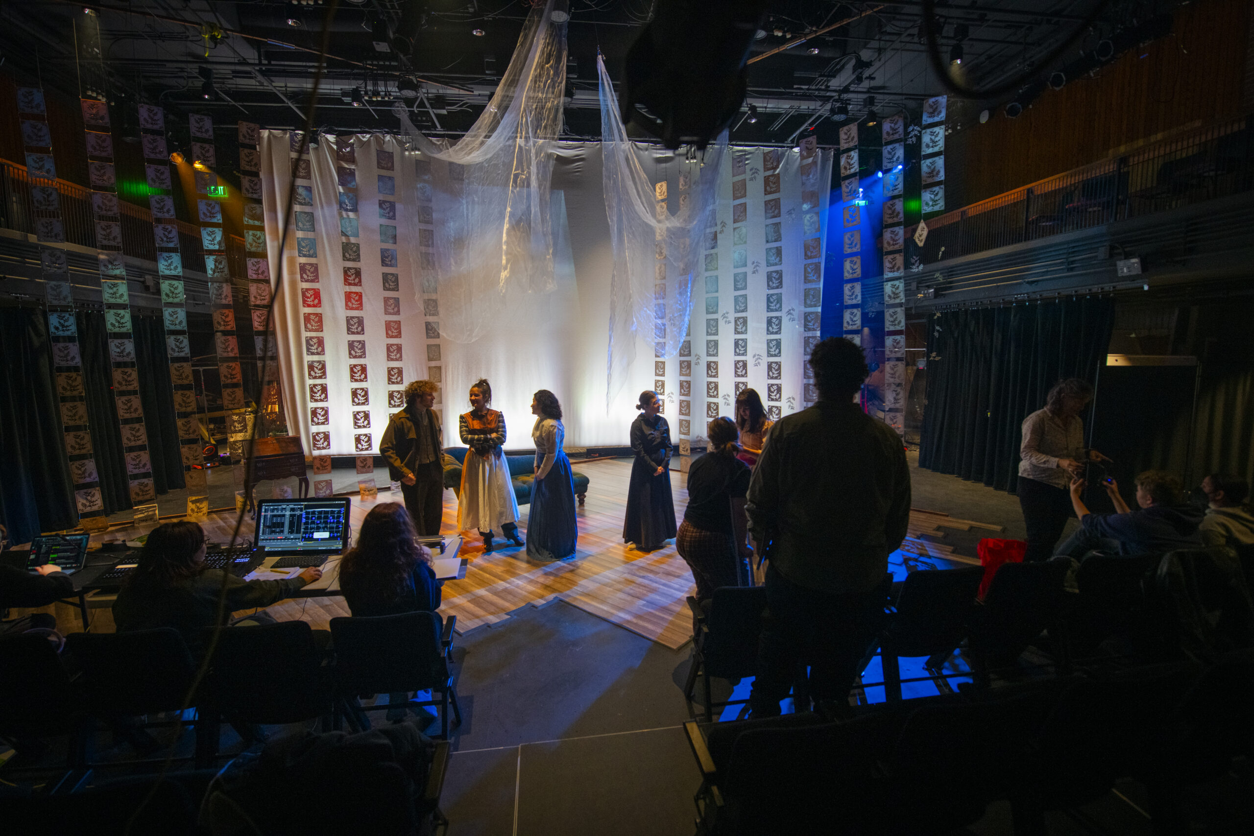 students rehearsing play on stage