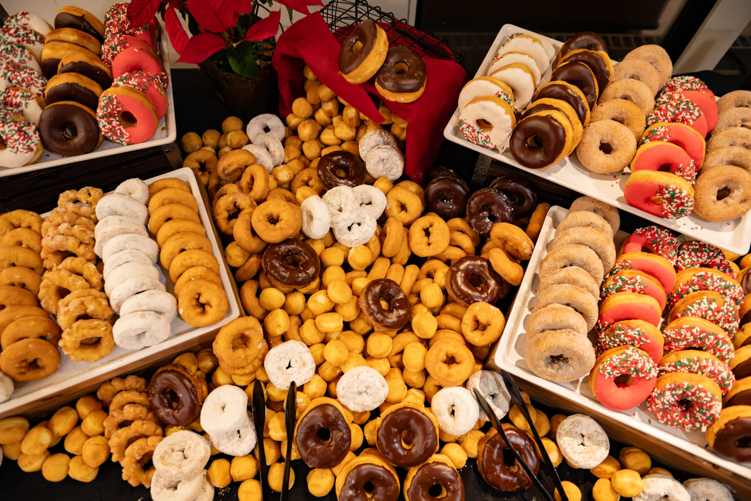 faculty serve students in the dining hall during late-night breakfast