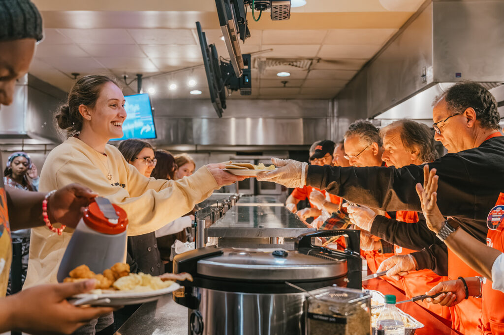 Administrators serve students at the fall 2023 Late Night Breakfast. Photo by Natalie Hoang ’25.