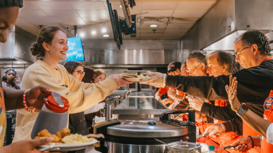 Administrators serve students at fall 2023 Late Night Breakfast