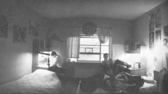 Students study in Clark University dorm room, 1964