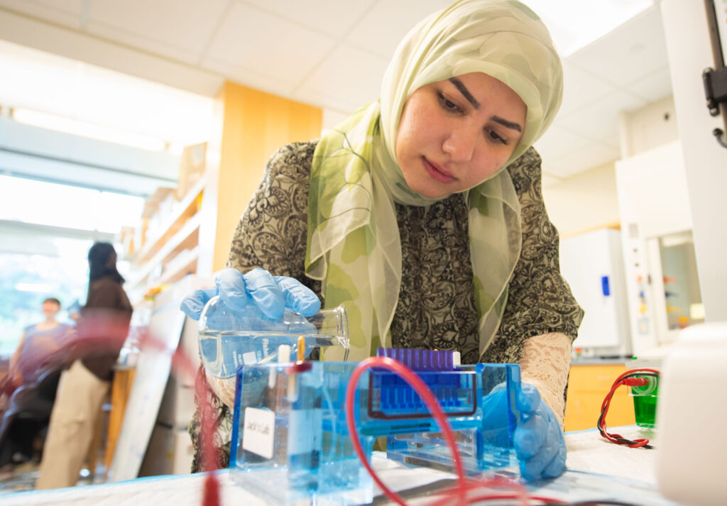 A doctoral student conducting research in the Jack lab.