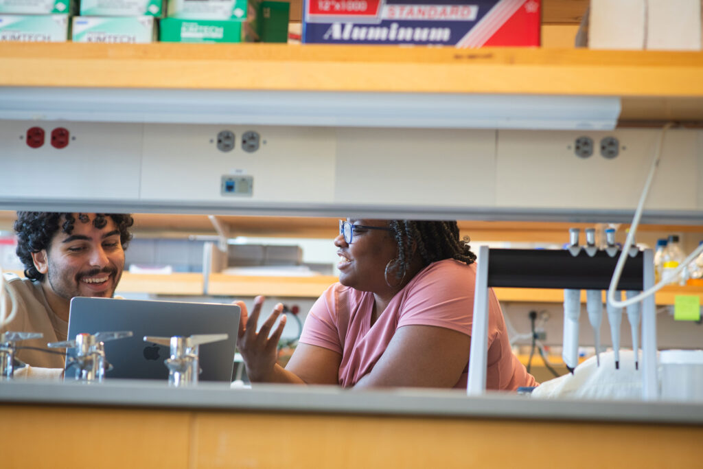 Student talking to Professor Chandra Jack