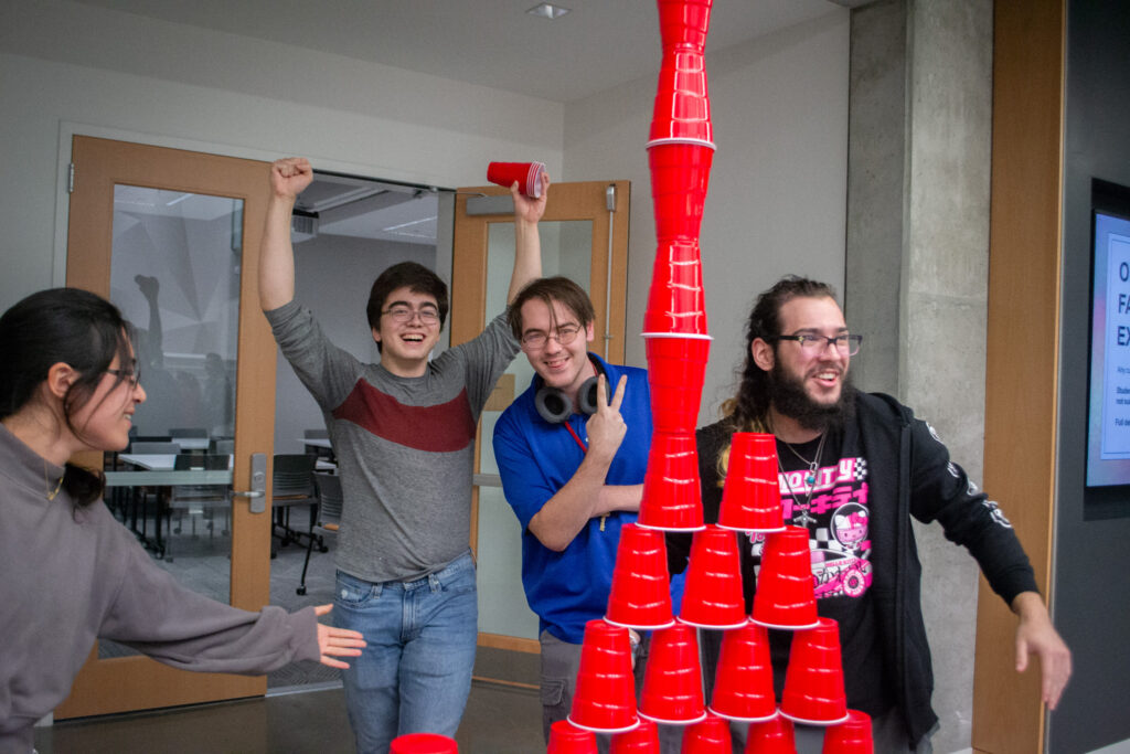 students make plastic cup tower at Hackathon