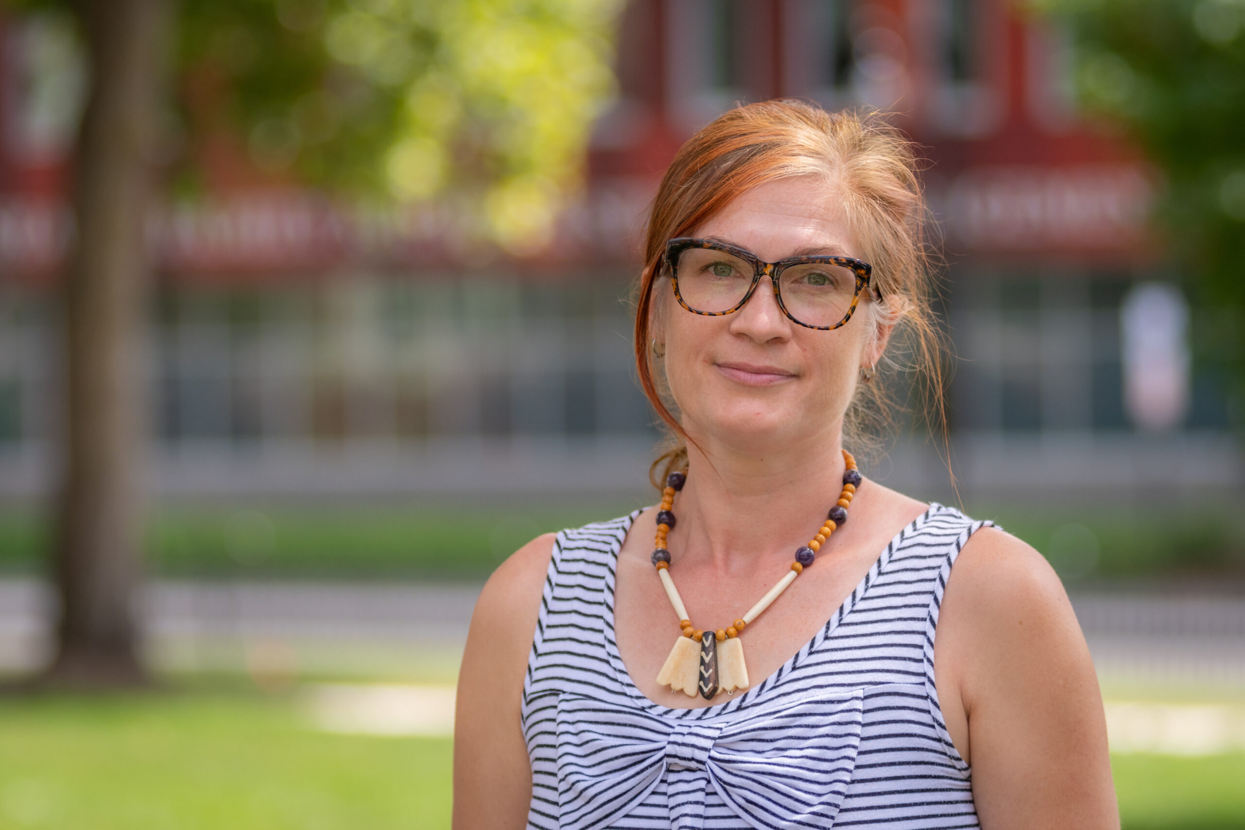 headshot of woman outside