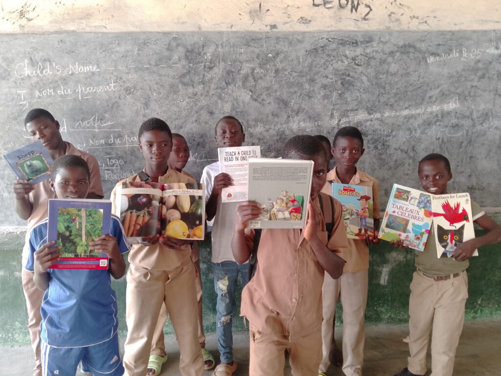 children hold books