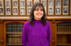 headshot of student wearing purple sweater